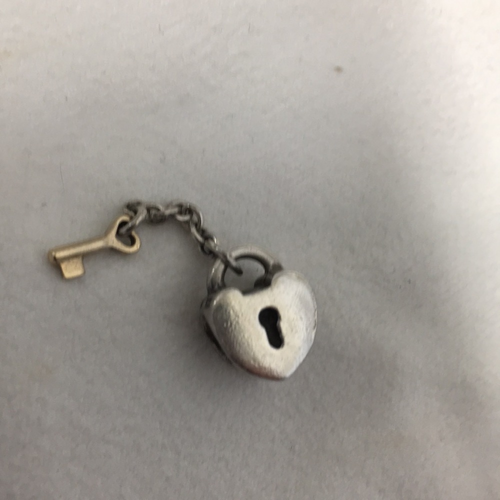 Pandora heart lock charm with gold key. RETIRED